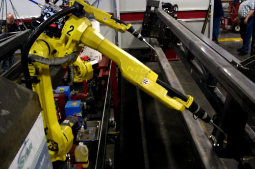 Welding robots in metal fabrication